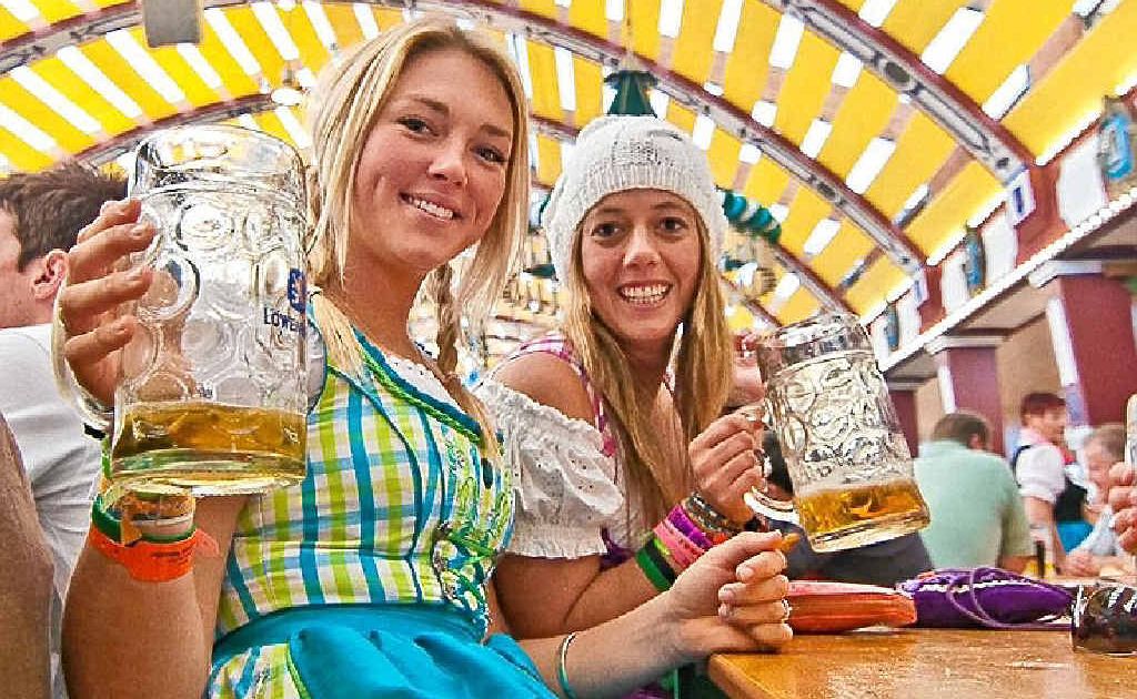 BOTTOMS UP: Beer drinkers flock to the Munich Oktoberfest. BOTTOMS UP: Beer drinkers flock to the Munich Oktoberfest.